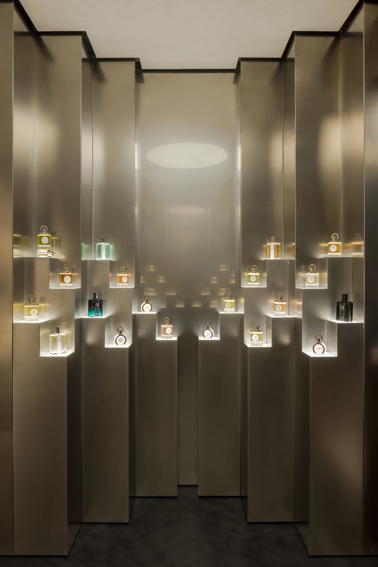 Parfums Caron, Rue Saint Honoré — Paris, France: Backlit staggered pedestals presenting perfume bottles as precious objects