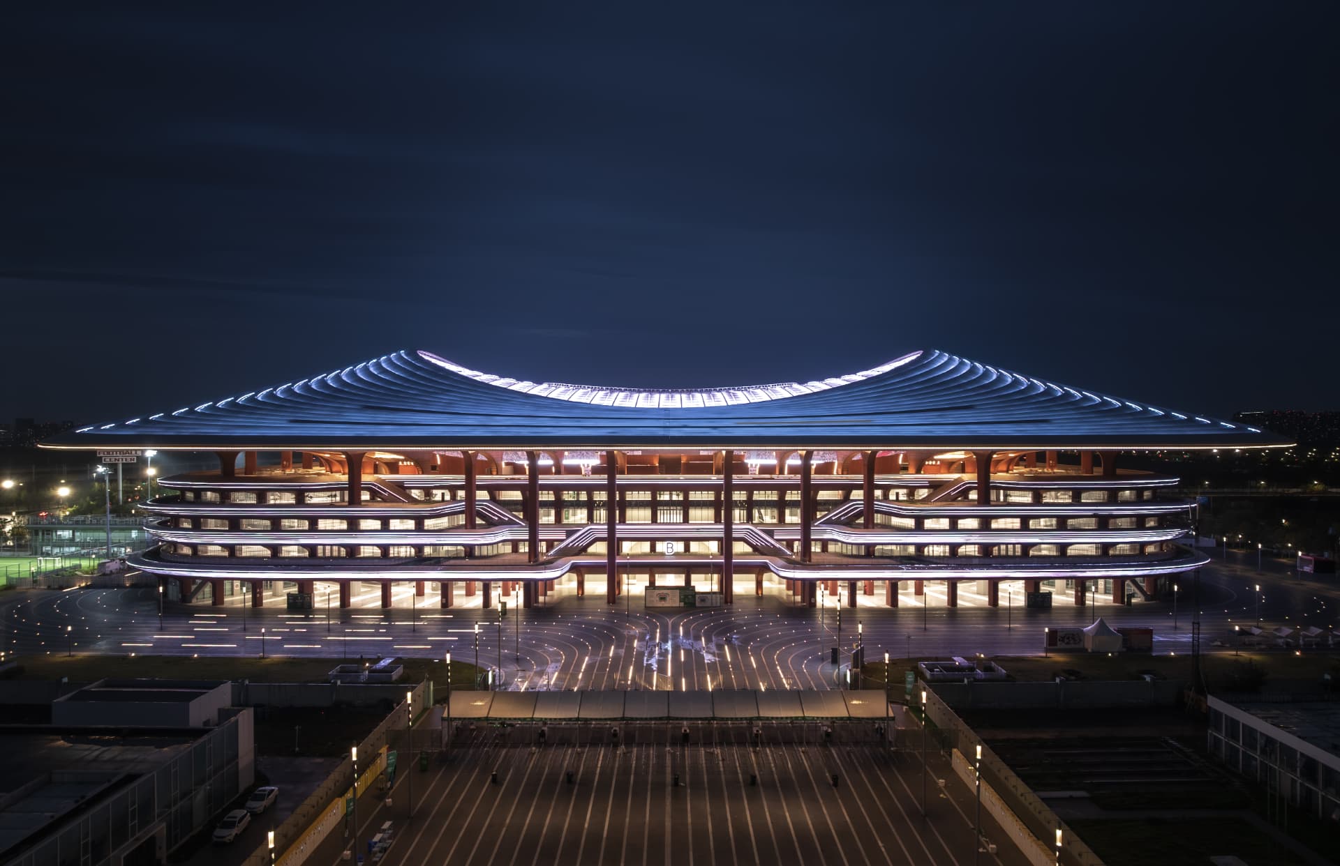 Xi'an International Football Stadium — Xi'an, China: Xi'an International Football Stadium, Xi'an — main elevation at night with illuminated roof edge