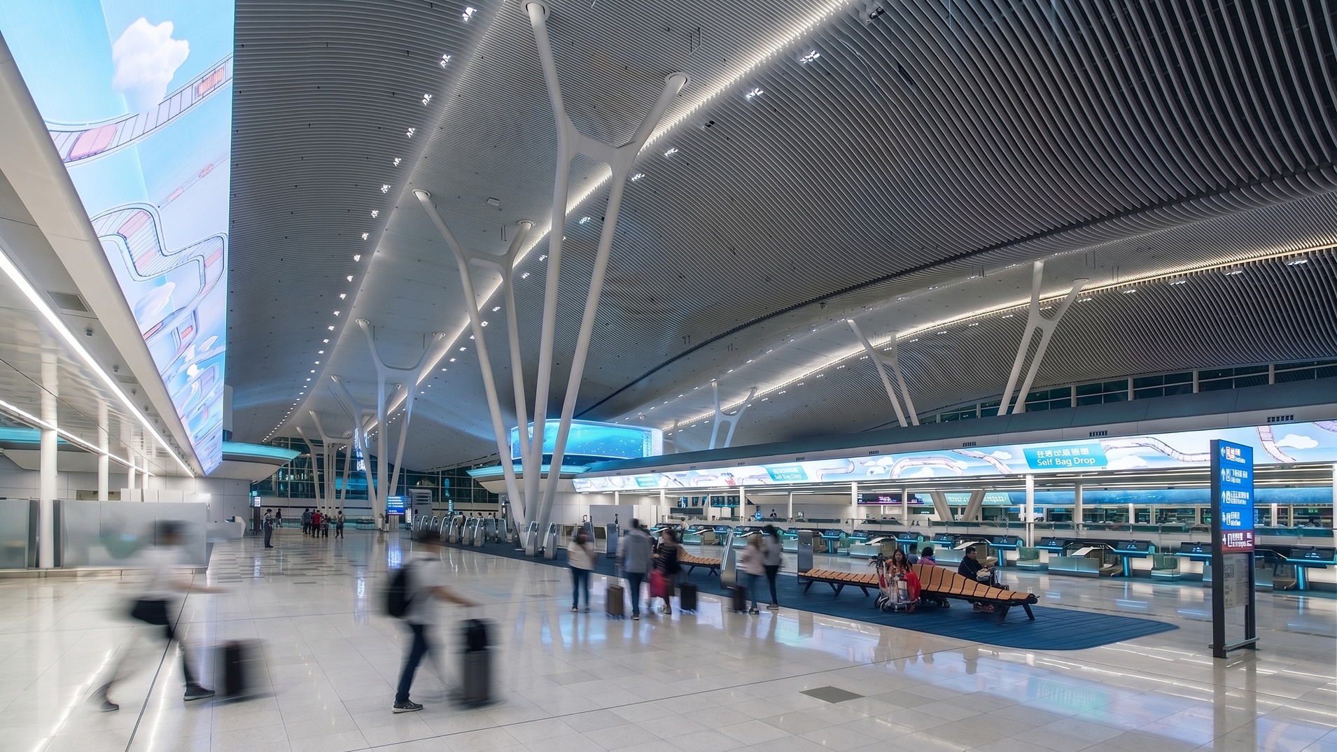 Hong Kong International Airport – Terminal 2 — Hong Kong: Hong Kong International Airport Terminal 2 — check-in hall with self bag drop counters, Lichtvision lighting design