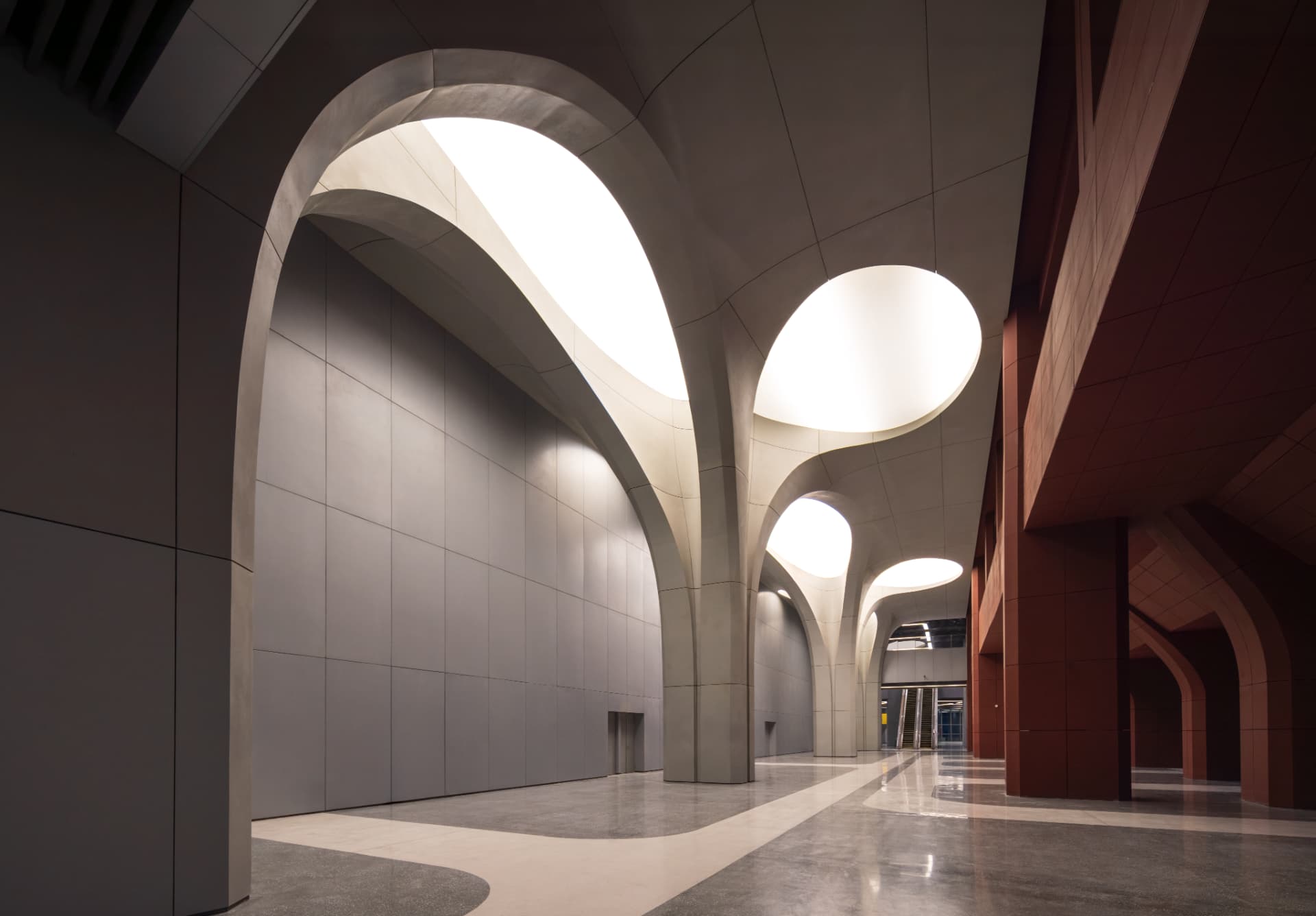 Xi'an International Football Stadium — Xi'an, China: Xi'an International Football Stadium, Xi'an — lit ceiling openings along the vaulted interior circulation