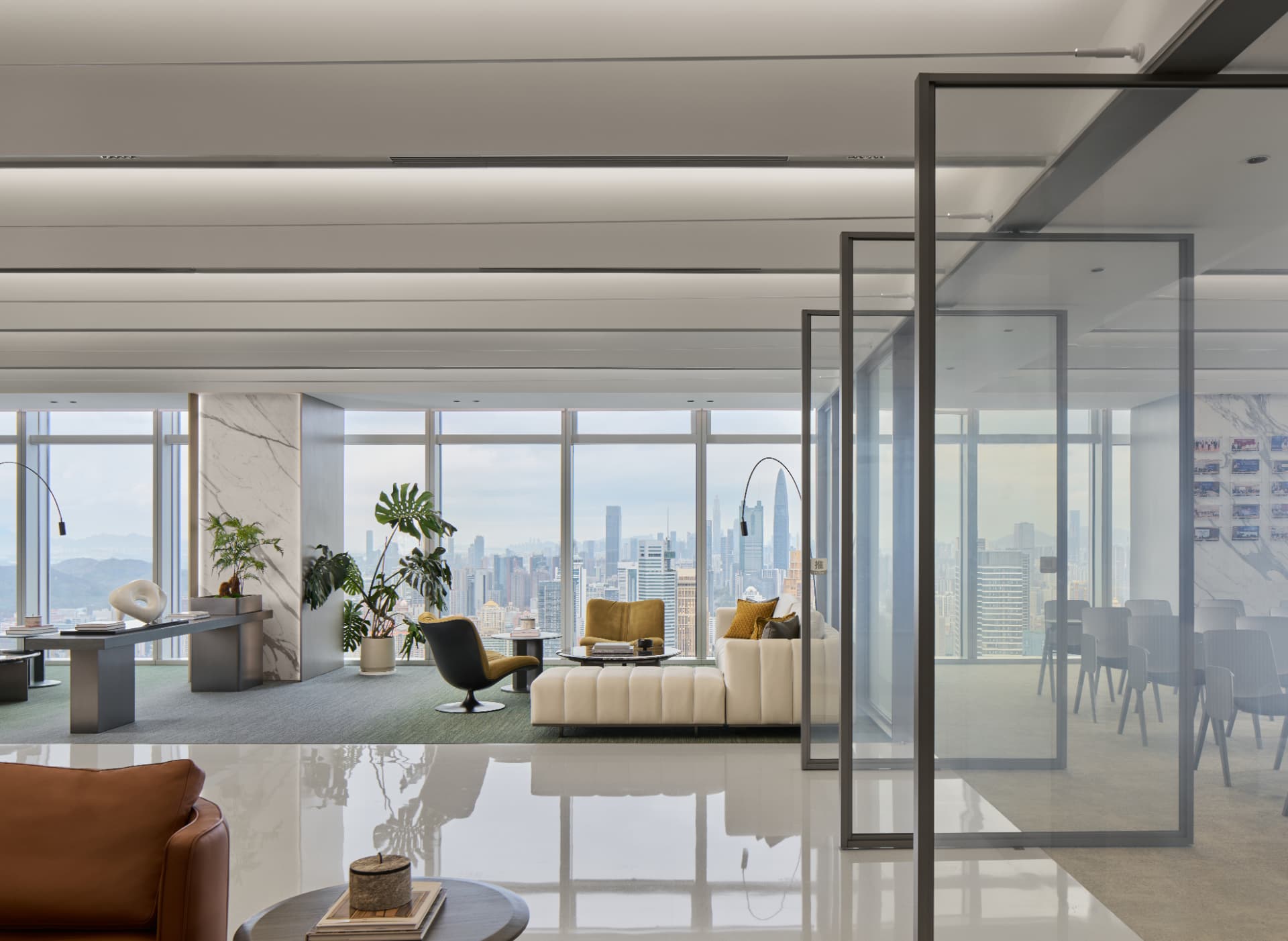 No.1 Shennan Road — China: No.1 Shennan Road, Shenzhen — office lounge with cove lighting and city view