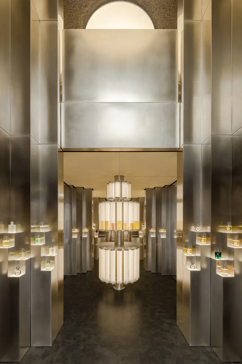 Parfums Caron, Rue Saint Honoré — Paris, France: Central illuminated perfume fountain within the metallic interior of the Caron boutique